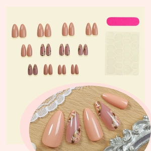Faux ongles amande français nude avec motifs floraux peints à la main et kit