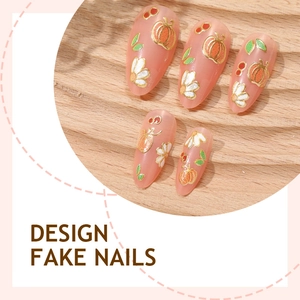 3D almond fake nails with golden pumpkin and white daisy patterns on peach base