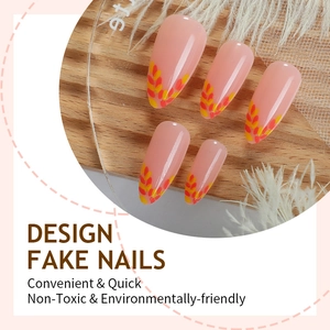 French style nude almond fake nails with autumn leaf design and orange tips