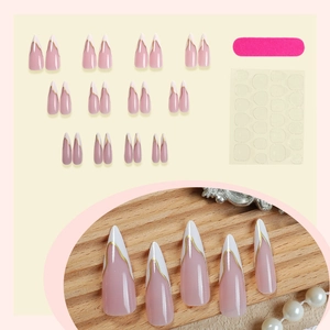 French tip long almond press-on nails with nude pink base and golden wavy lines decoration