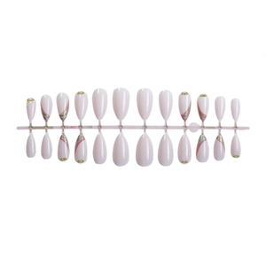 French almond fake nails with pink glitter lines, gold beads and rhinestones on white base
