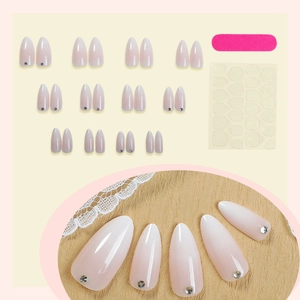 Gradient pink almond press-on nails with rhinestone accents and full application kit