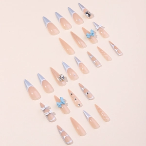 Long stiletto press-on nails with silver French tips, 3D bows, and crystal rhinestones