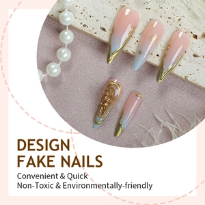 Long almond press-on nails with blue-pink gradient, gold angel relief and star patterns