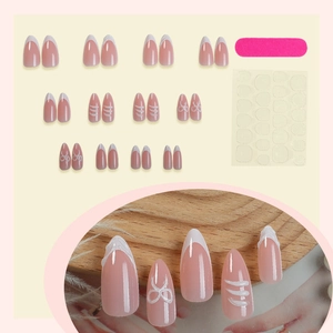 Pink almond press-on nails with white French tips, 3D bows and embossed line details