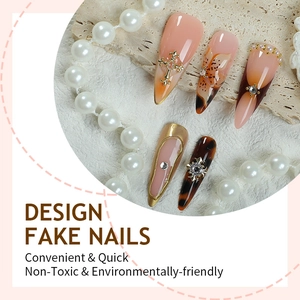Faux ongles 3D avec fleurs, perles et strass sur pierres, design long pointu