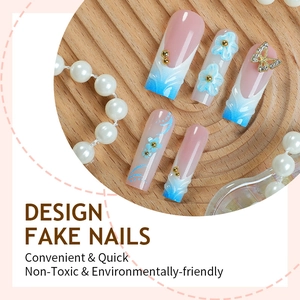 Blue gradient long pipe fake nails with 3D floral accents and elegant bow charms