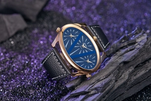 Detail of Oulm multi-timezone watch with rose gold case and black leather strap