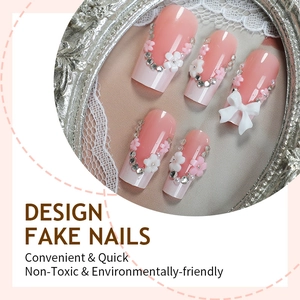 Pink gradient fake nails with white 3D bows, flowers and diamonds in vintage silver frame