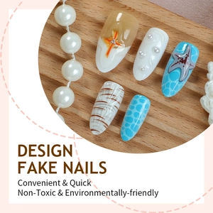 3D ocean themed press-on nails with 3D starfish, pearls, and sea wave patterns