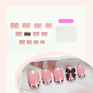 Short square press-on nails with leopard French tips and black 3D bows full set kit
