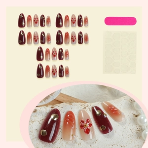 Red almond press on nails with hand-painted flowers, pearls and nail glue accessories