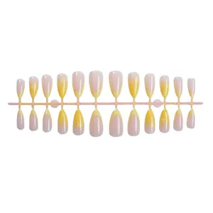 24pcs yellow French tip almond press-on nails with gradient flower design on a white background