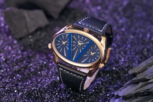 Close-up of Oulm rose gold oval watch featuring three sub-dials and black leather strap