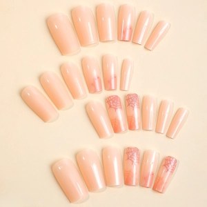 Halloween nude pink press on nails featuring spooky ghost patterns and glitter spider webs
