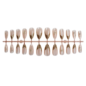 Almond press-on nails with 24 pieces featuring gold chrome waves and glitter star patterns
