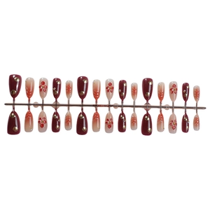 Almond press on nails set with 3D resin flowers, pearls and red gradient finish