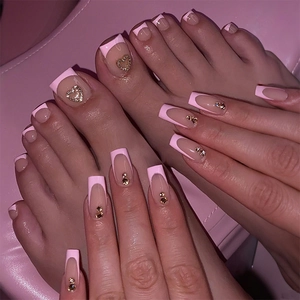 Matching pink French tip press-on nail set for hands and toes with heart rhinestones