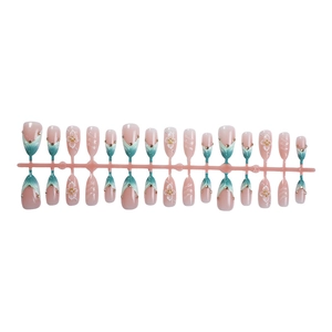 3D press-on nails set with amber blue French tips, floral accents, and pearl rhinestones