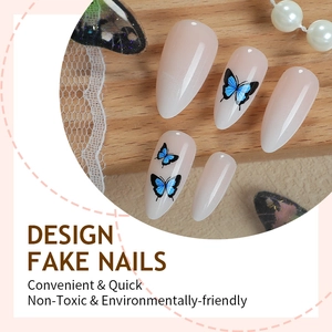 Minimalist almond press on nails with soft nude gradient and blue butterfly patterns