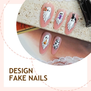 Almond-shaped Halloween press-on nails with cartoon ghost patterns on pink jelly base