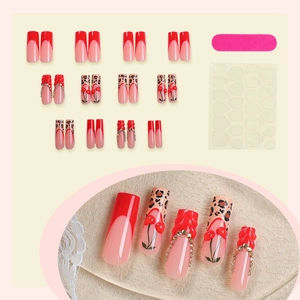 Long coffin fake nails with red French tips, leopard print, cherries and rhinestones