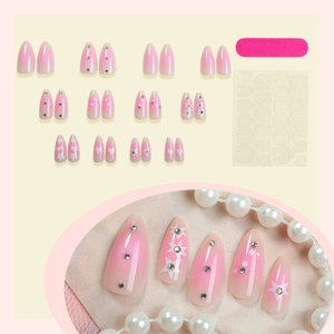 Almond press-on nails with pink gradient, silver rhinestones and white stars kit