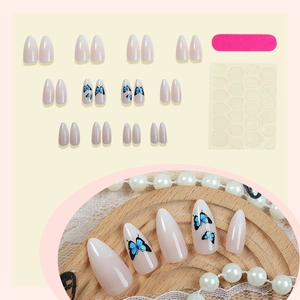 French almond press on nails with blue butterfly pattern and nude pink gradient design