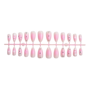 Pink gradient press-on nails with white stars and rhinestones in teardrop shape