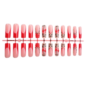 Long coffin press-on nails with red French tips, leopard print, and cherry rhinestone decor