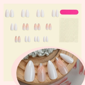 French almond press-on nails with white leaf design and pink gradient glitter finish