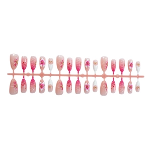 3D pink floral press-on nails with white gradient and gold accents in long stiletto shape