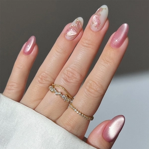 Golden wave and crystal paved ring set showing elegant 3D butterfly glitter nail style