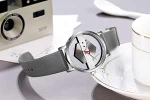 Detail view of镂空 transparent dial with bold red second hand and matte grey leather strap