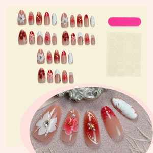 3D pink and white floral press-on nails with pearls, seashells, and nail tool kit