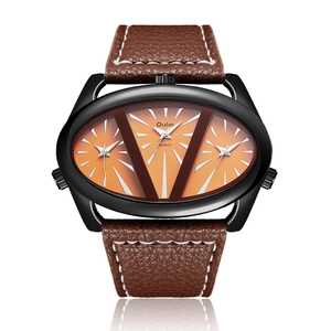 Detail view of Oulm multi-timezone quartz watch with orange dials and brown leather strap