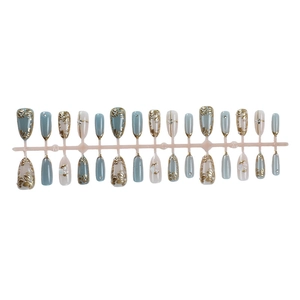 Golden leaf cat eye press-on nails with blue and cream floral gold foil design