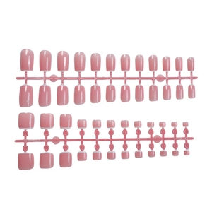French style medium length press-on nails with nude pink base and white tip accents