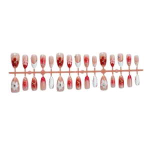 3D pink floral press-on nails with pearls, crystals, and starfish designs in long coffin shape