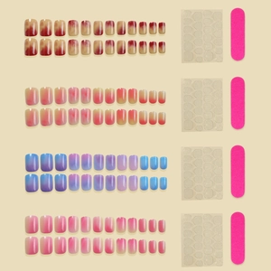 Detail view of four colorful gradient press-on nail sets with application tools