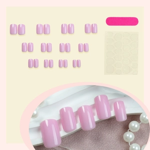 Short pink press-on nails set with glossy finish including nail file and jelly glue pads