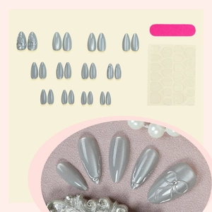 Silver grey cat eye press-on nails in almond shape with 3D silver bow accents