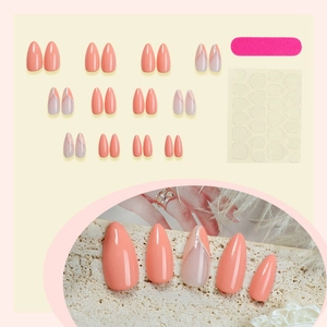 Almond press-on nails set in coral orange with glitter accents and French tip design