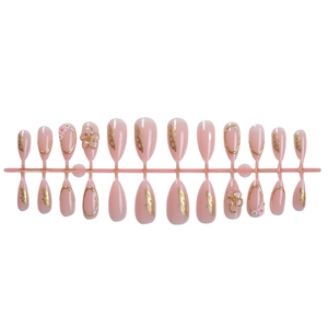 French almond press-on nails in soft pink with 3D gold flowers and embossed patterns