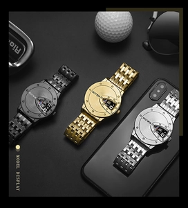 Three men's triangle dial watches in black, gold, and silver on a dark textured desk