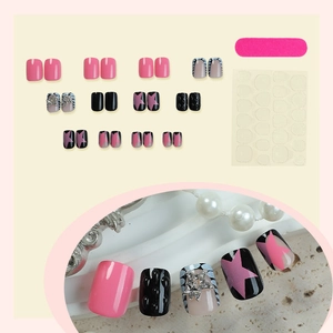 Star pattern press-on nails set with pink and black 3D rhinestones and silver accents