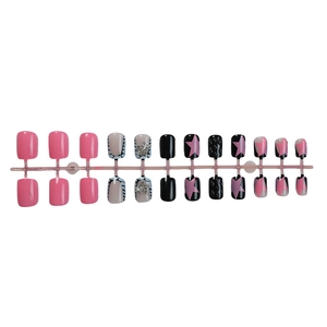 Short press-on nails set with pink star designs and sparkling rhinestone accents