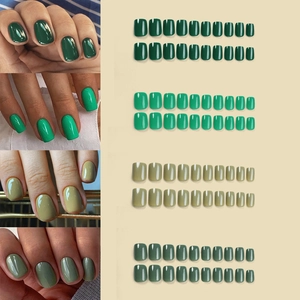 Short press-on nails set featuring four shades of glossy green and olive tones