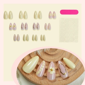 Almond press on nails with yellow floral patterns and gold lines full set with tools