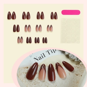 French almond press-on nails set in reddish-brown glitter design with tools